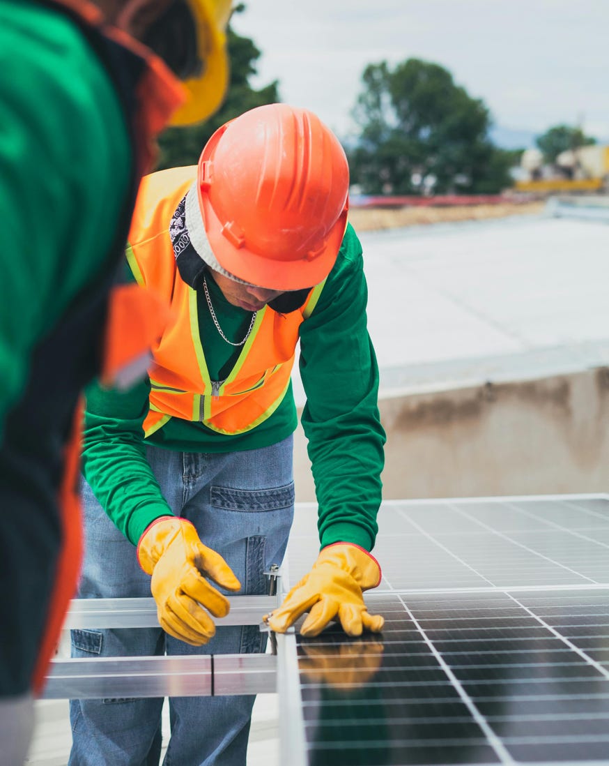 Solar Technician Installing Solar Panel